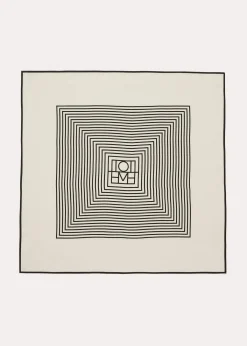 Centered monogram silk scarf crème