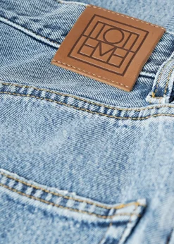 Tapered leg denim worn blue